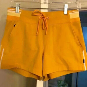 Athleta Triumph Game Point Shortie mini-shorts.  Yellow.  Size S